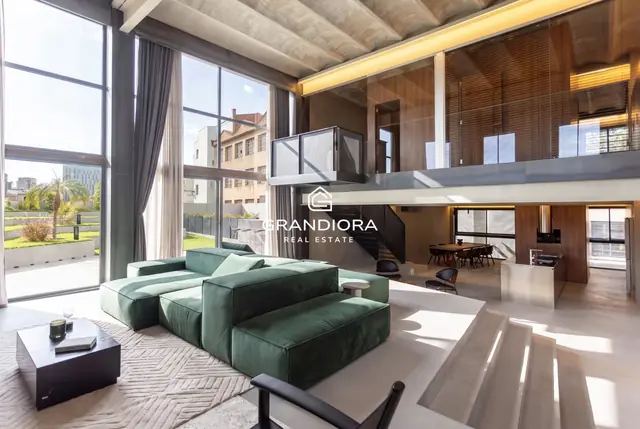 Designer loft with 185 m² interior and 157 m² landscaped terrace in Poblenou